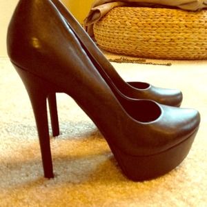Black leather pumps
