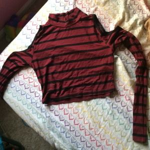 Tight crop top. Holes where shoulders go.