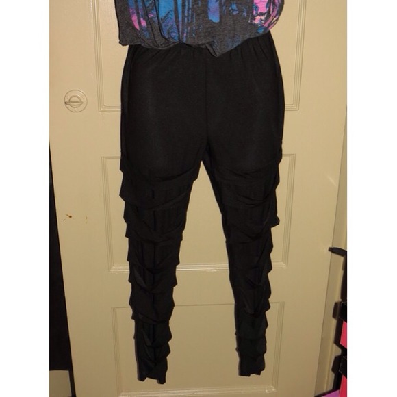 Black leggings with cut ups down the legs
