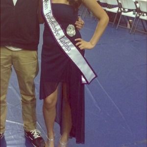 Navy blue strapless high-low dress.