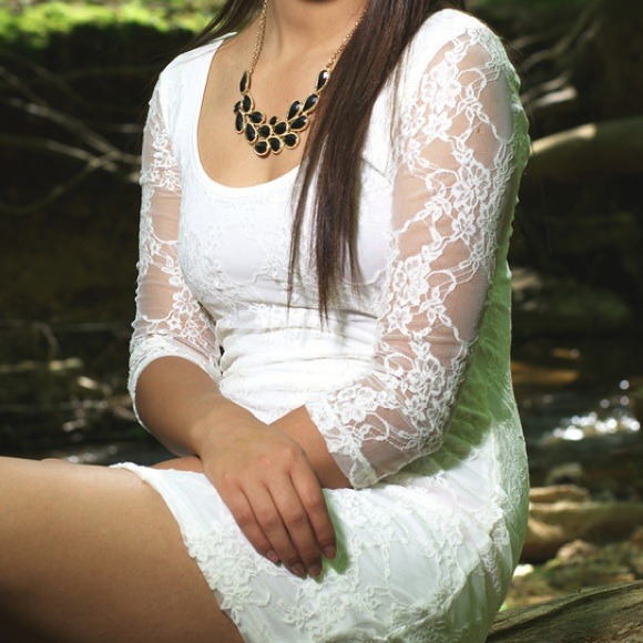 White laced long sleeve dress.