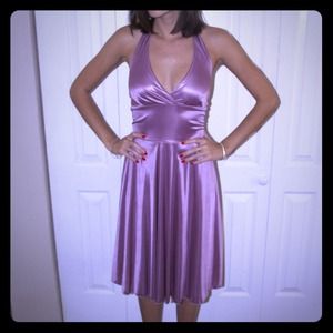 Halter dress with fitted waist. Flairs at bottom