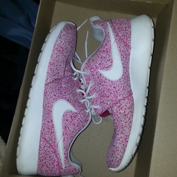 Pink and white roshe runs