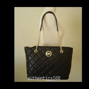 Michael kors gold chained purse.