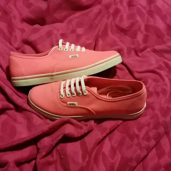 Coral/orange vans.