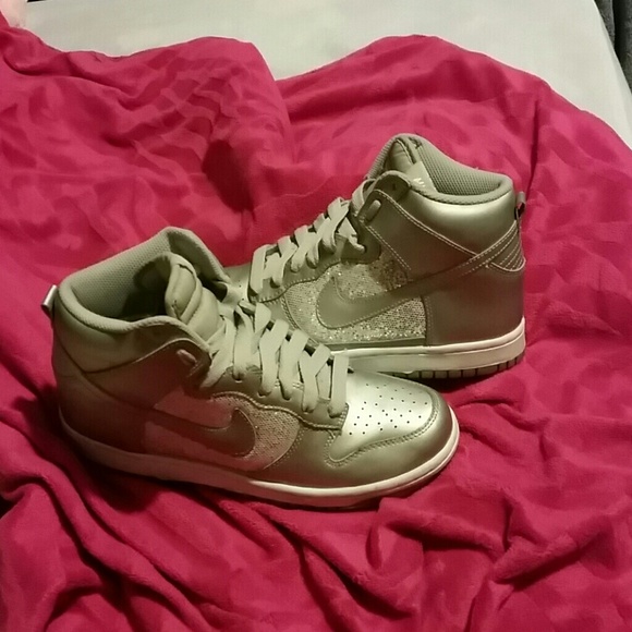 Silver hightop Nike's.