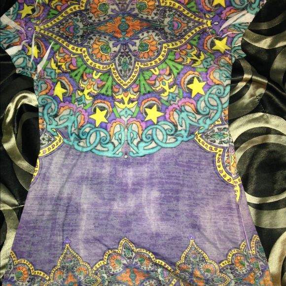 Colorful, tight fitting shirt.