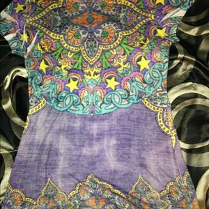 Colorful, tight fitting shirt.