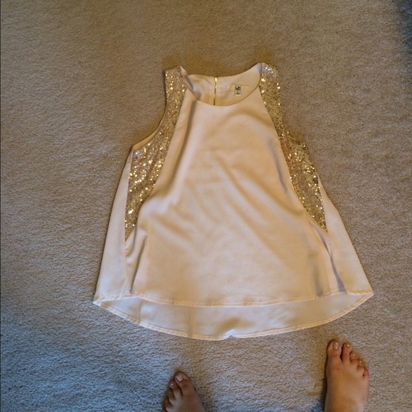 Cream colored top with sequin detail