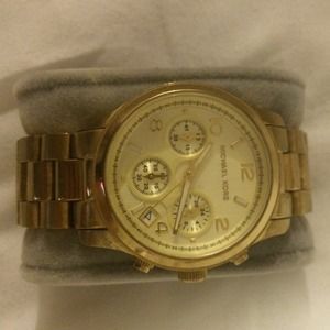 MK gold mid-sized watch.