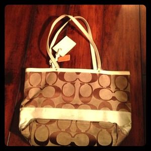 Brown and white fabric Coach purse