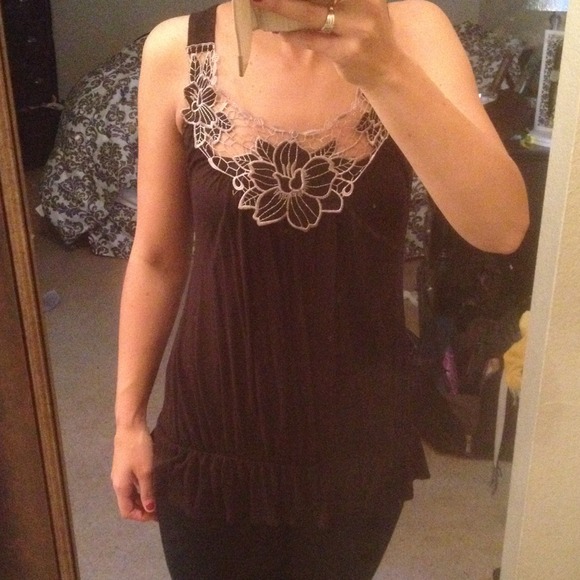 Black tank top with trim.