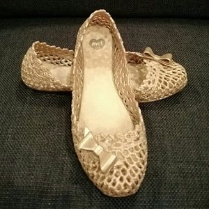 Cute golden Mel from Melissa shoes.