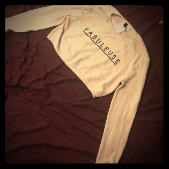 cropped light pink sweater.