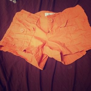 Orange short shorts.