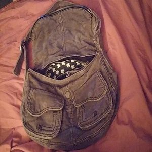 A corduroy gray  pocketbook.