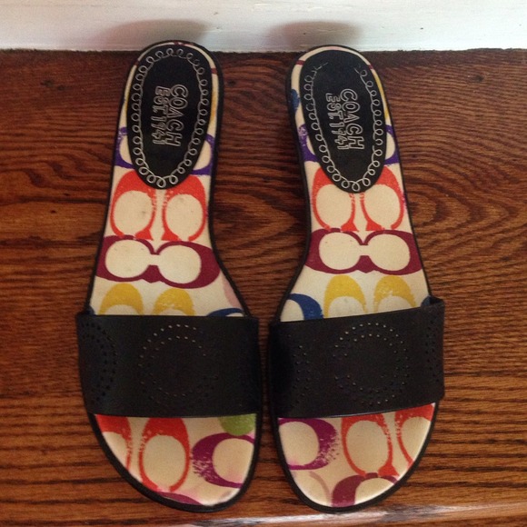 Black logo coach sandals.
