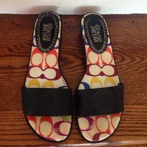 Black logo coach sandals.