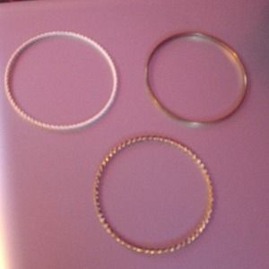 1 white & 2 gold bracelets
