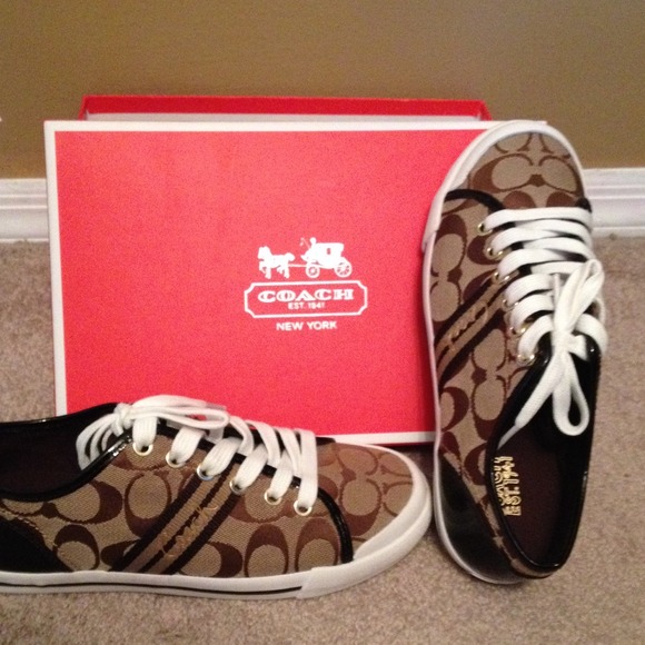 Brand new, never worn Coach Sneakers.