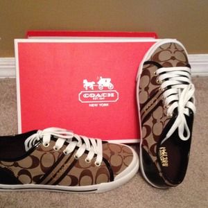 Brand new, never worn Coach Sneakers.