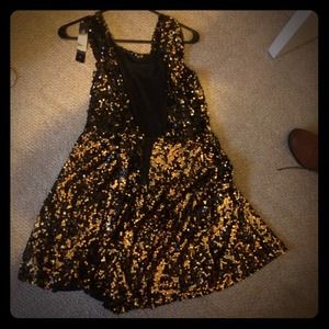 A gorgeous gold and black holiday dress.
