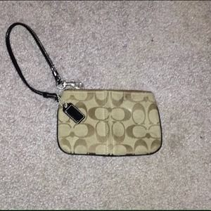 Brown coach wristlet, pink lining!