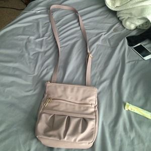 Dark cream color. Little scratches on zippers.