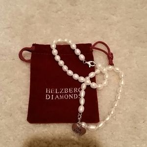 Two pearl bracelets help berg diamonds