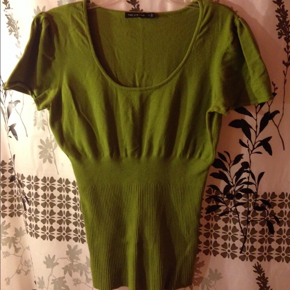 Green  sweater bundled with black shirt