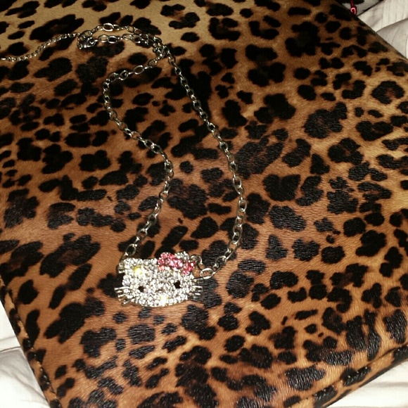 Crystal Hello Kitty with a  silver tone chain.