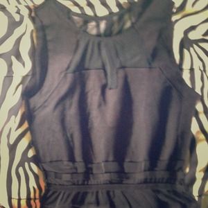 Black short dress . See-through material at top