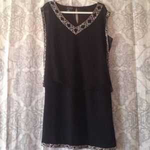 Short black dress embellished. New without tags.