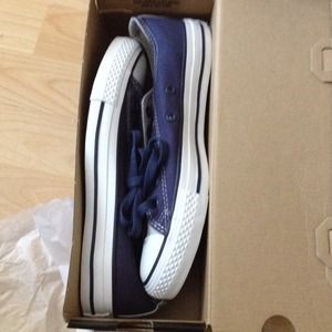 Grey an navy blue converses.