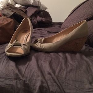 Peep toe, wedge heel. Worn a few times.