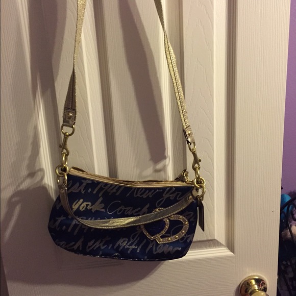 Navy Blue and Gold COACH purse.