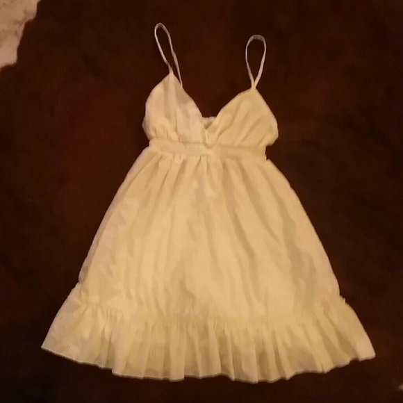 Light yellow eyelet spaghetti strap dress.