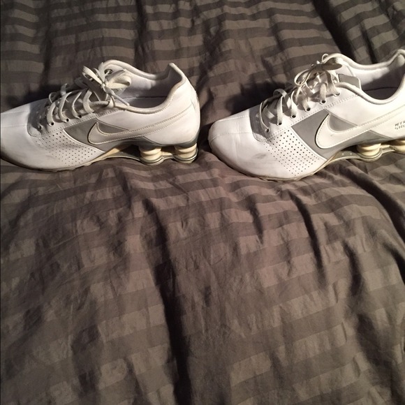 White and silver Nike shocks