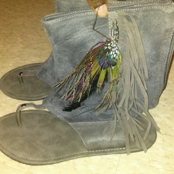Hi-top sandles with fringe and peacock feathers.