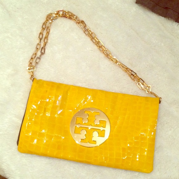 Yellow Tory Burch clutch with gold chain