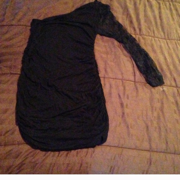 One sleeved black fitted dress