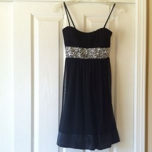 Black dress with sequined trim. Never worn.