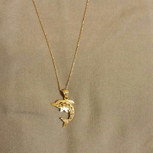 10k beautiful gold dolphin necklace.
