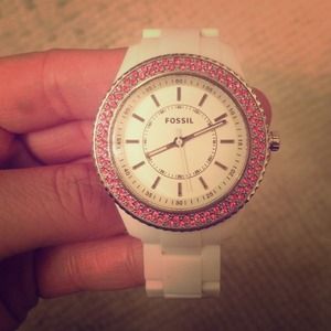 White watch with pink accent crystals around face