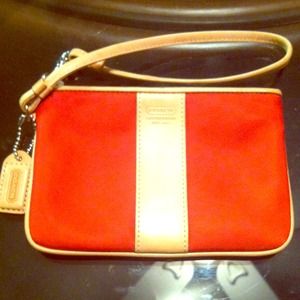 Red Coach wristlets with light tan leather detail