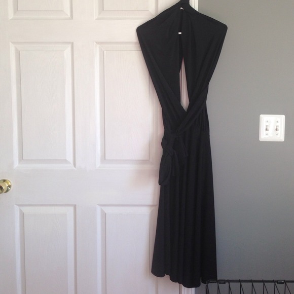 Black strap wrap dress by Dressy Group. - Picture 1 of 3
