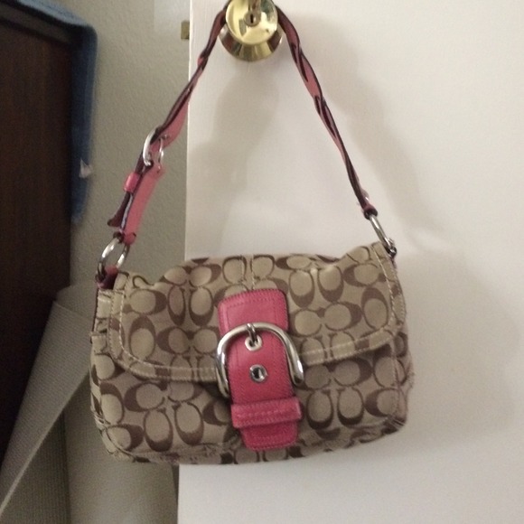 Authentic coach handbag with pink shoulder strap