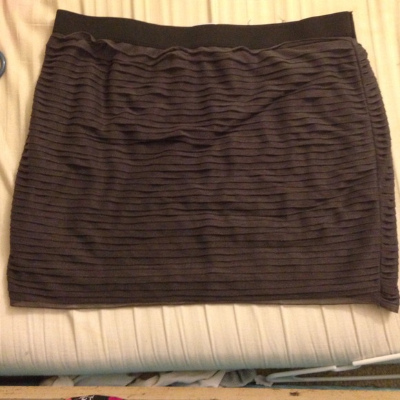 A cute, dark grey pencil skirt with slight ruffles