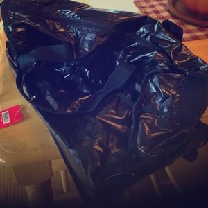 Handle and wheeled luggage bag in metallic Navy