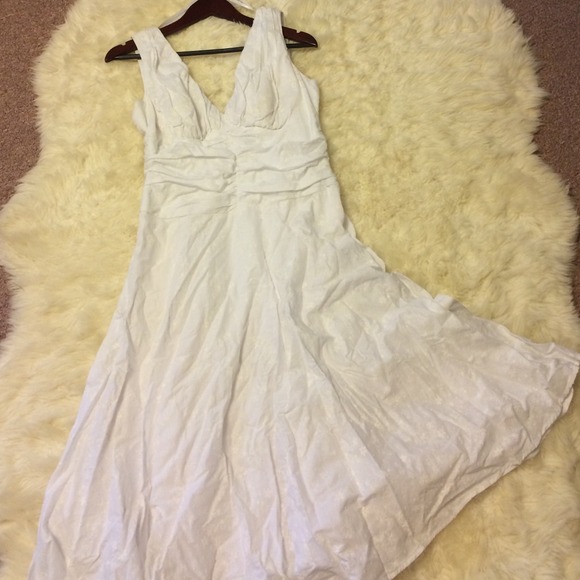 White dress, with flower details.